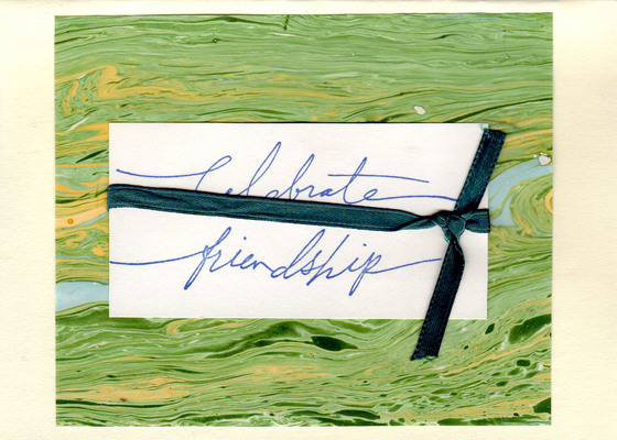 176 - 'Celebrate Friendship' on green marbled paper with a bow