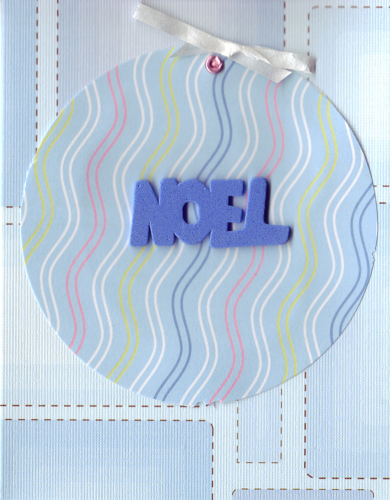 087 - Blue 'Noel' on wavy-paper ornament on patterned blue card