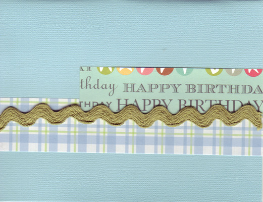 016 - 'Happy Birthday' on teal paper with ribbon