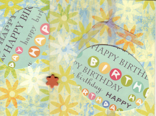 101 - 'Happy Birthday' on green and purple floral paper with ribbon and flower embellishments