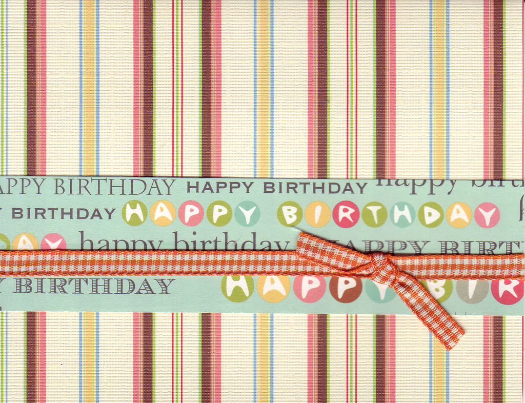 008 - 'Happy Birthday' on festive striped paper with ribbon