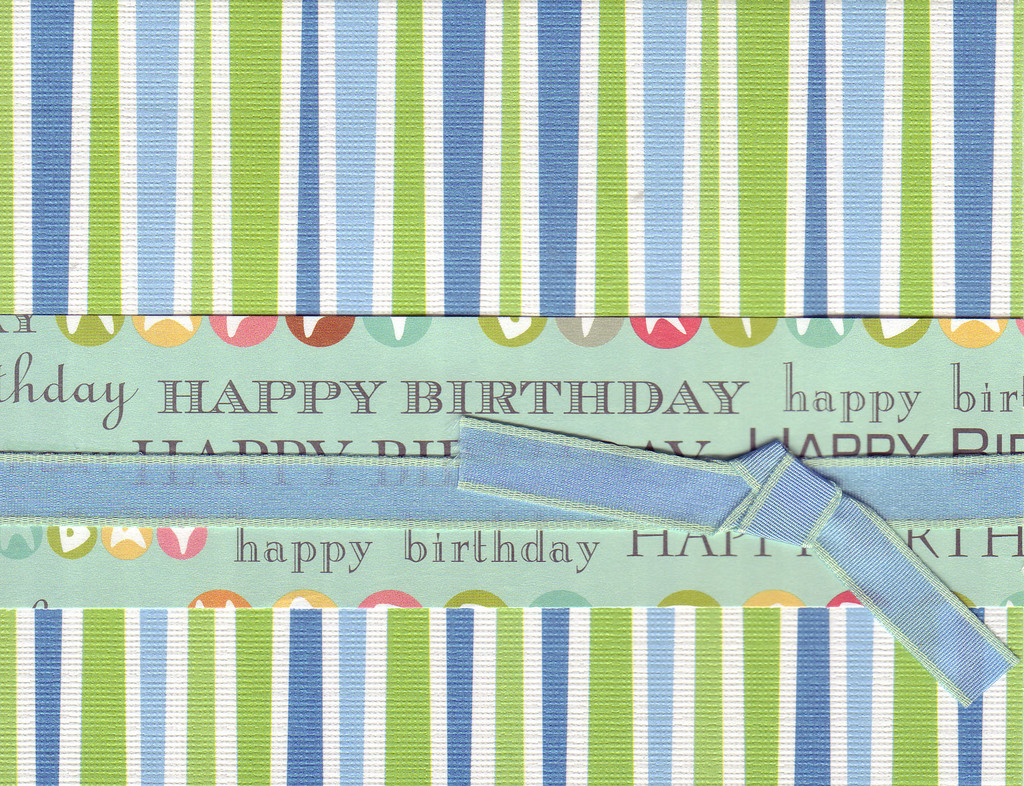 013 - 'Happy Birthday' on festive striped paper with ribbon