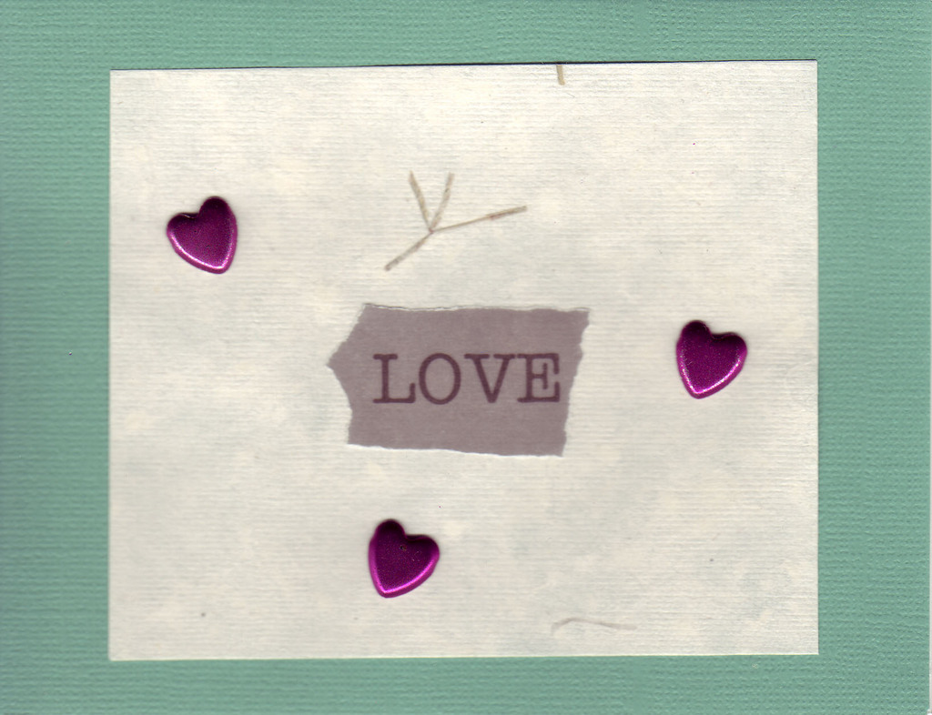 042 - 'Love' with hearts on green paper