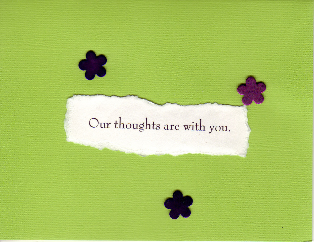 074 - 'Our thoughts are with you' on lime green with tasteful black flowers