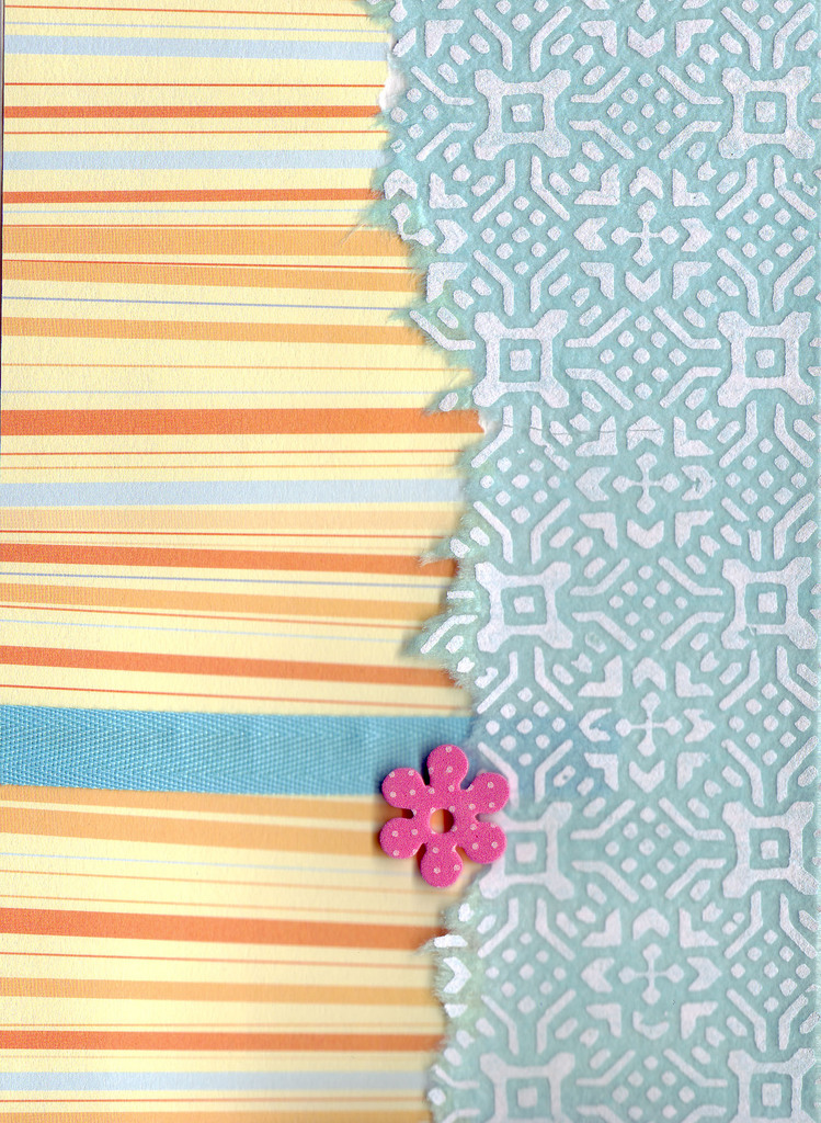098 - Orange striped paper, with blue ribon and overlaidd elegnatly patterned paper with flower embellishment