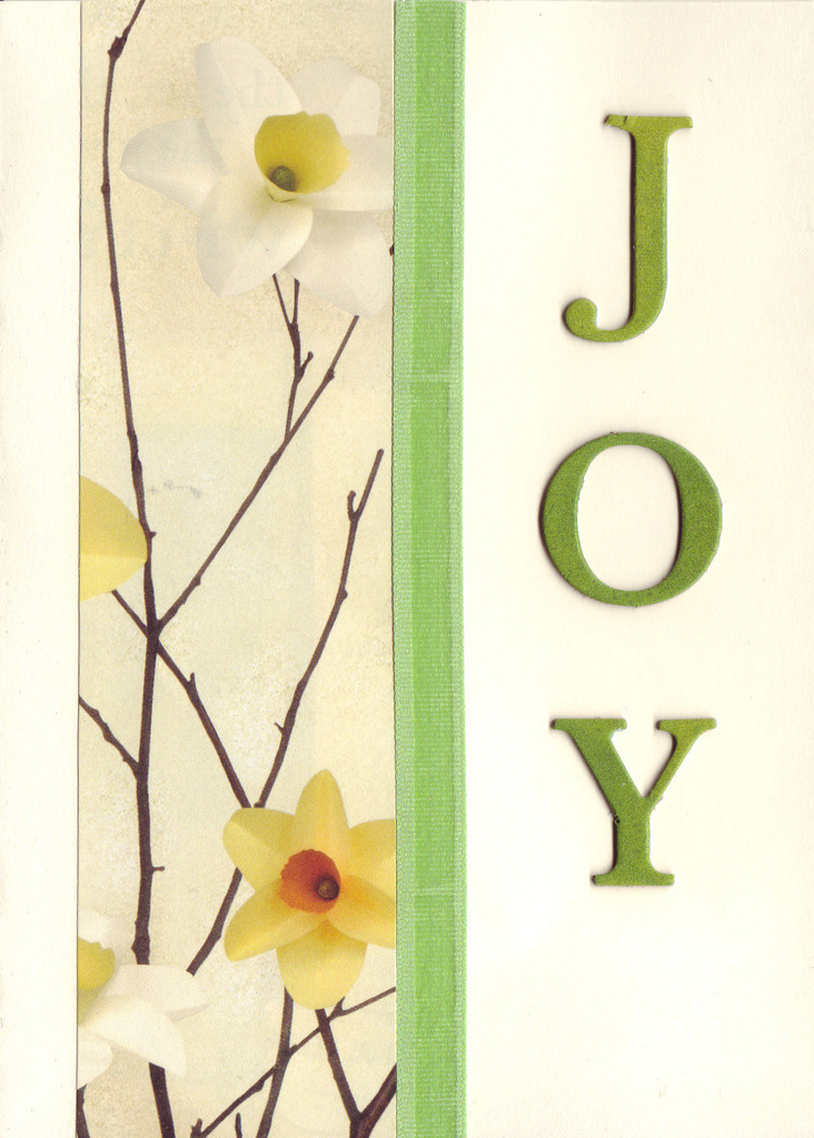 127 - 'Joy' on daffodil print paper with green ribbon