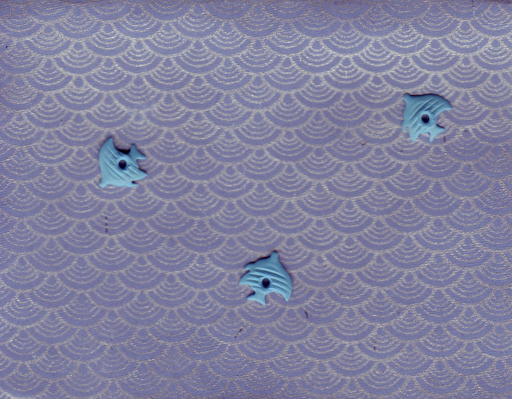 132 - Three blue fish brads swimming on a blue card with silver waves