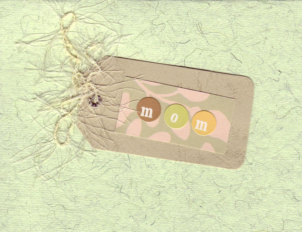 017 - (SOLD) 'Mom' on a pink, green and brown tag on green flocked paper