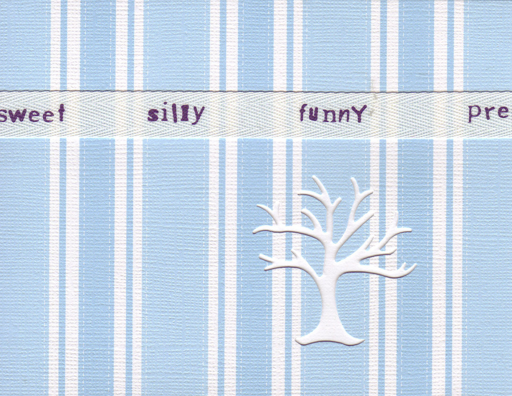 126 - 'Sweet, silly, funny' on a ribbon on blue striped paper
