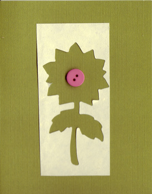 009 - Textured khaki paper with overlaid ivory paper with a large flower cut-out and button