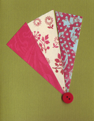 024 - Paper fan with button over deep green card