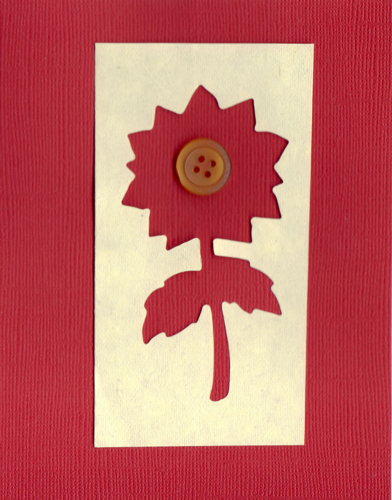 001 - Textured red paper with overlaid ivory paper with a large flower cut-out and button