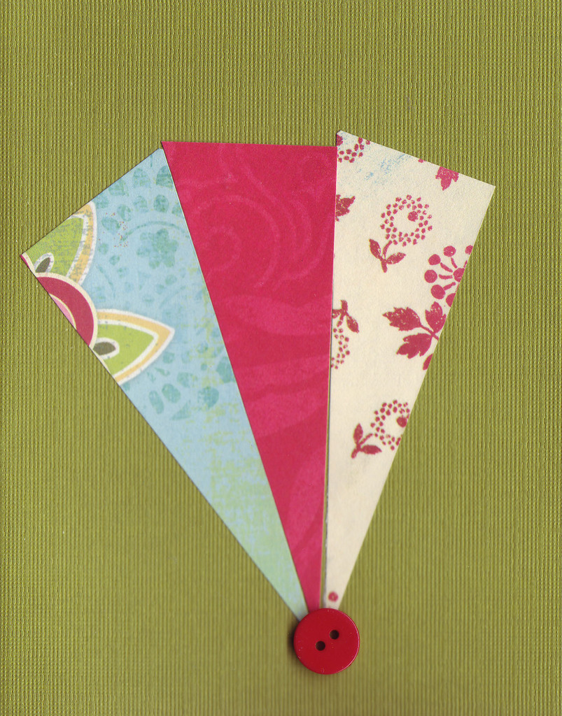 021 - Paper fan with button over deep green card